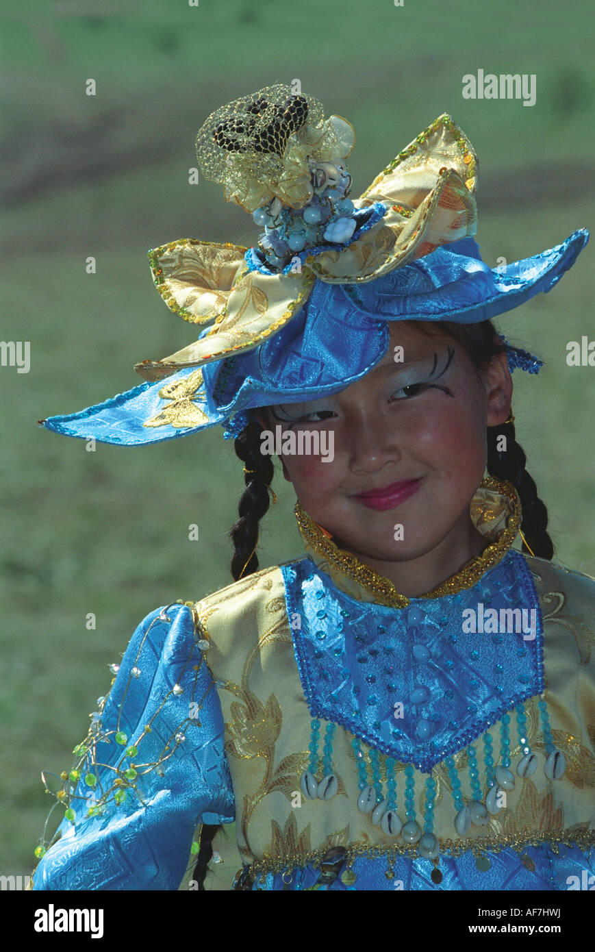 Portrait of a girl in handmade costume made in native Altaic manner. El-Oiyn - national festival of Altaic people. Russia Stock Photo