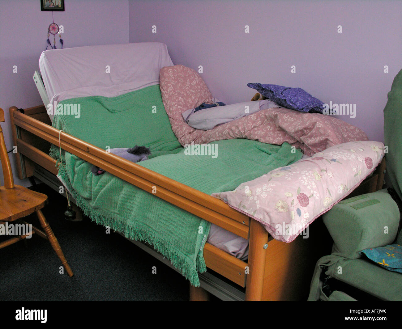 disabled person s adjustable bed with bell attached for summoning