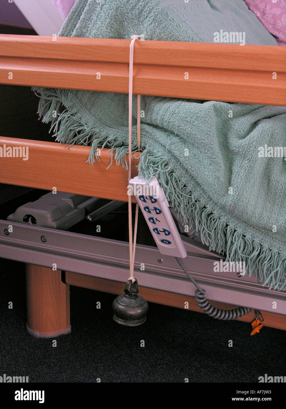 disabled person s adjustable bed controls with bell attached for