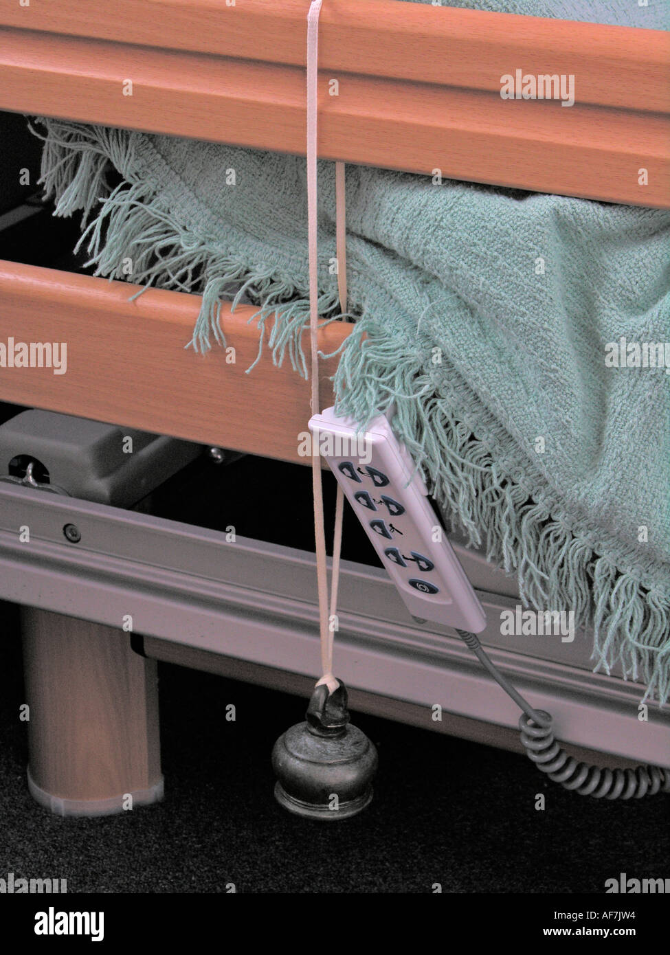 disabled person s adjustable bed controls with bell attached for