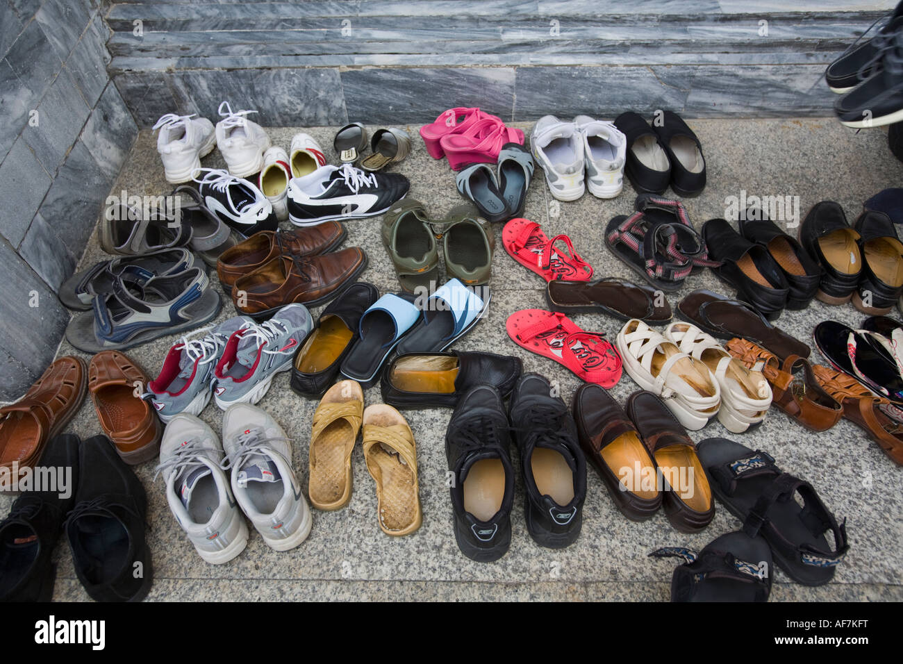 Visitors footwear outside the Temple of the Emerald Buddha Wat Phra Kaew Grand Palace complex Stock Photo