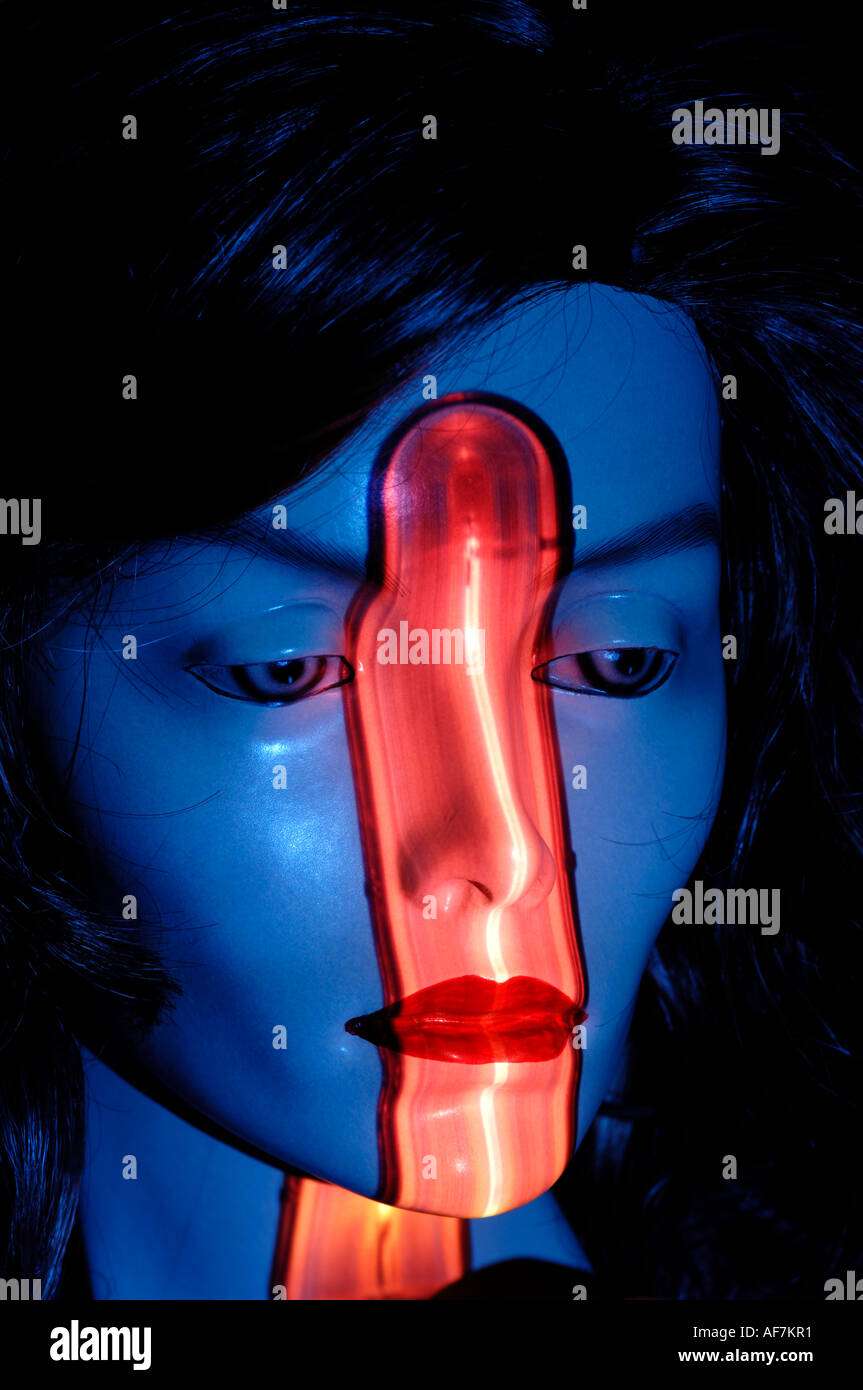 Female mannequin head with red projected image Stock Photo