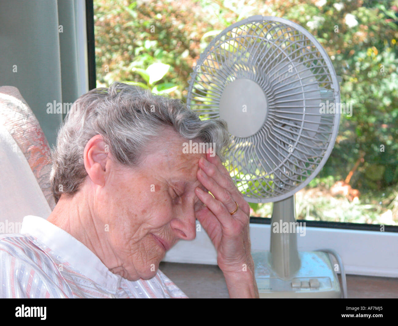 elderly woman suffering from heat exhaustion due to extreme high temperatures older people