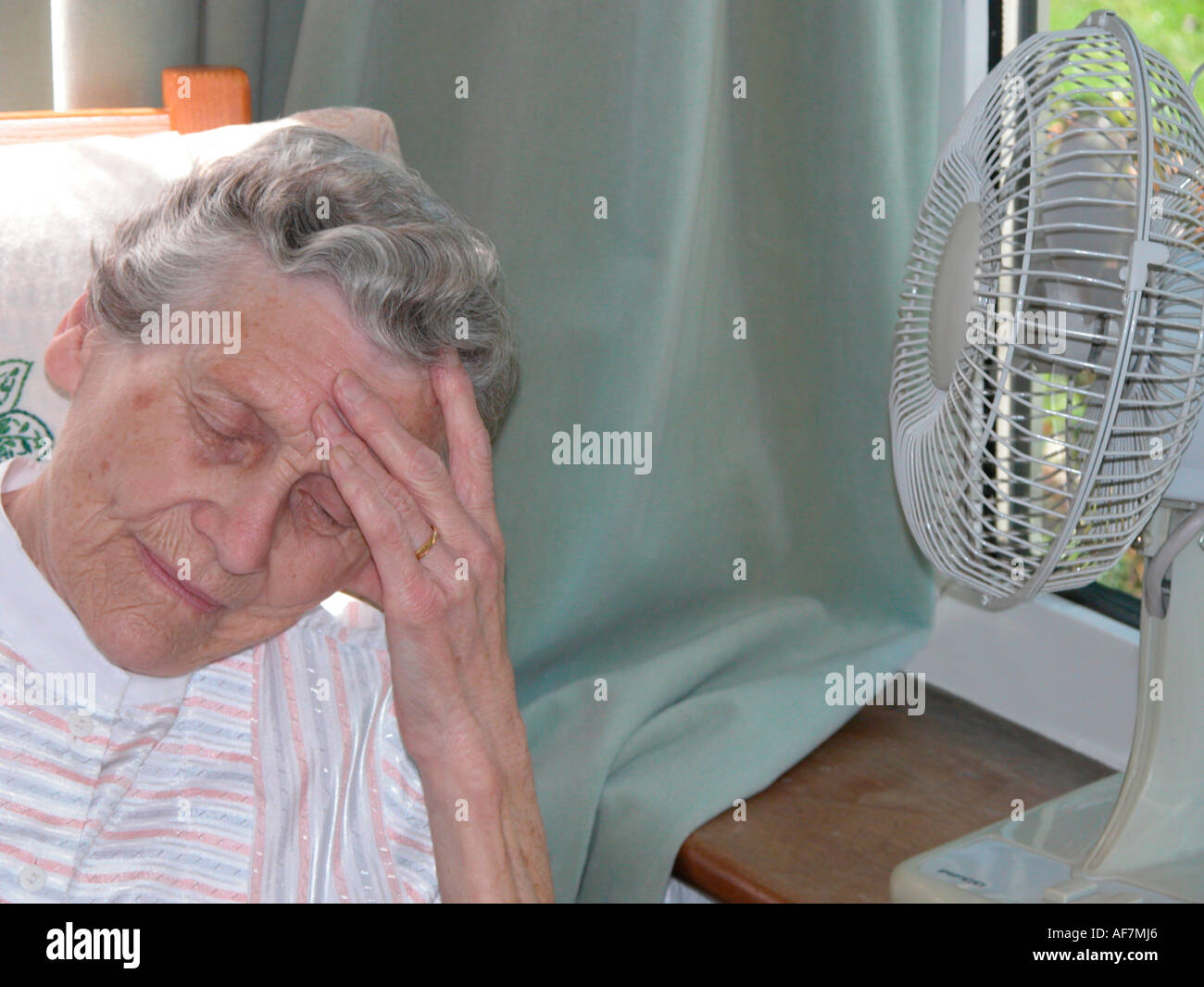 Elderly woman suffering from heat exhaustion due to extreme high temperatures older people