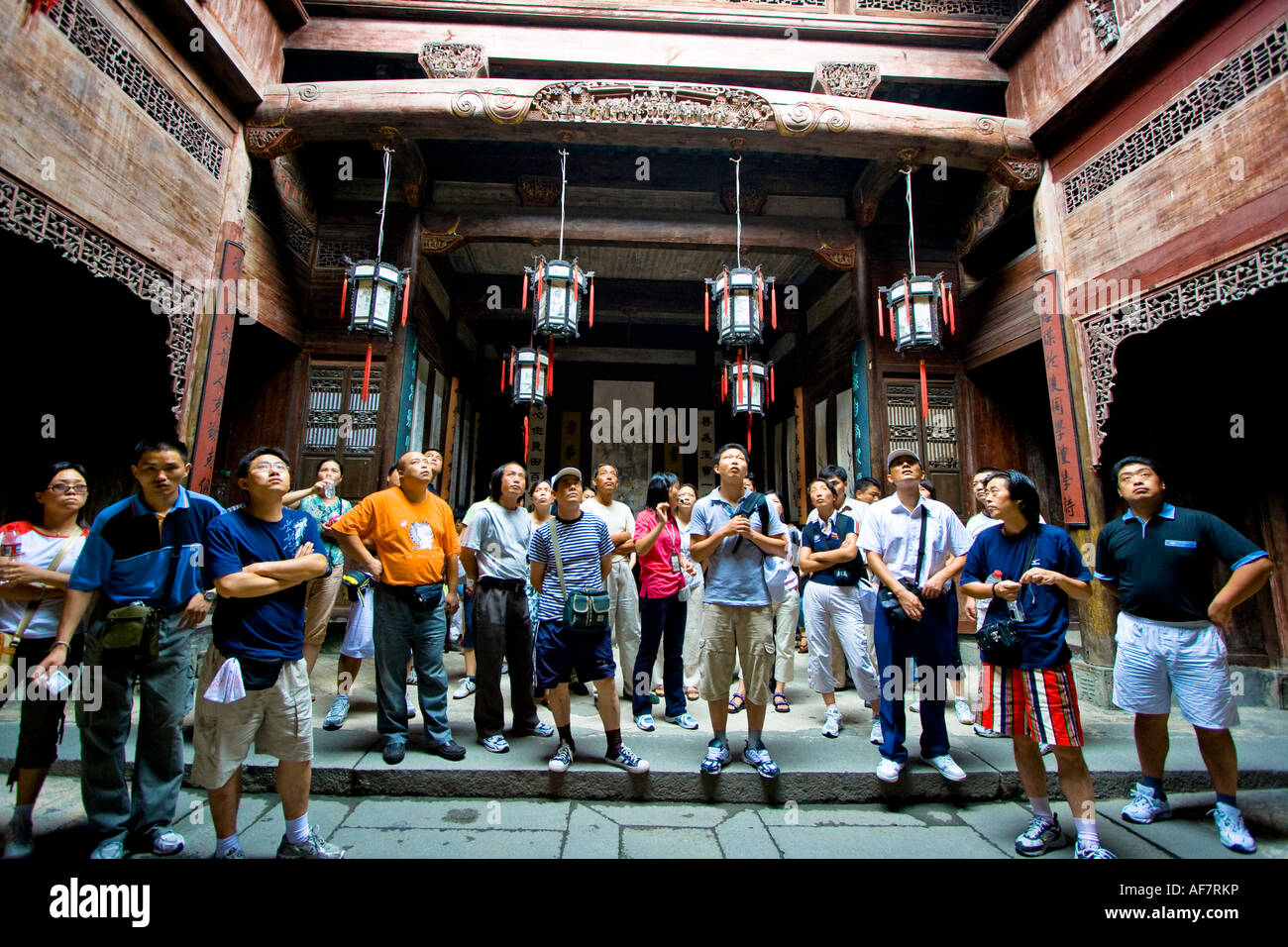 Domestic Chinese Tourists with of Guide of Architectural Details, Chengzhi Hall a Huizhou Style House, Hongcun, China Stock Photo