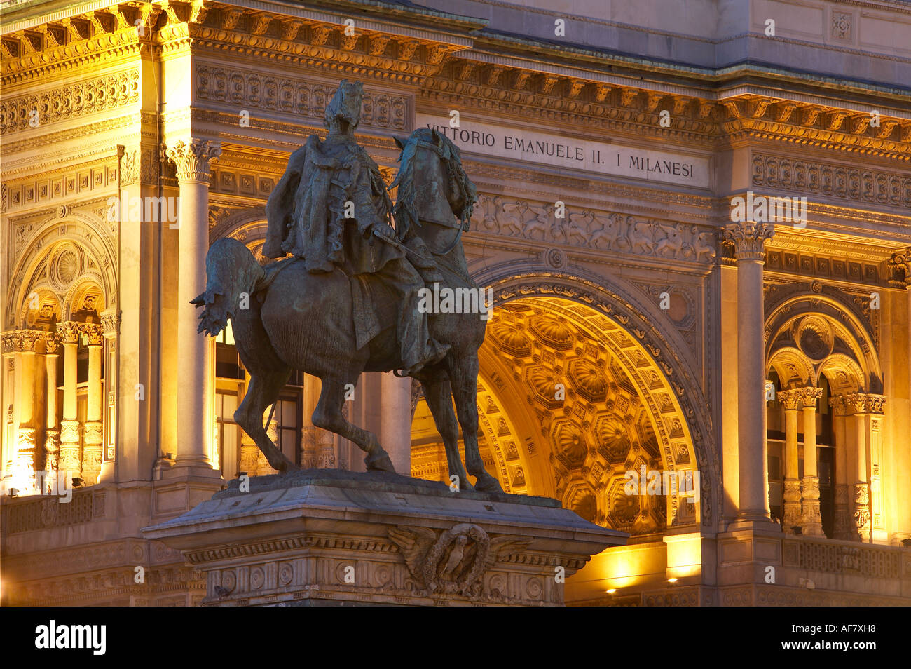 Statue to Vittorio Emanuele II and facade of Galleria Vittorio Emanuele II Piazza del Duomo Milan Lombardy Italy NR Stock Photo