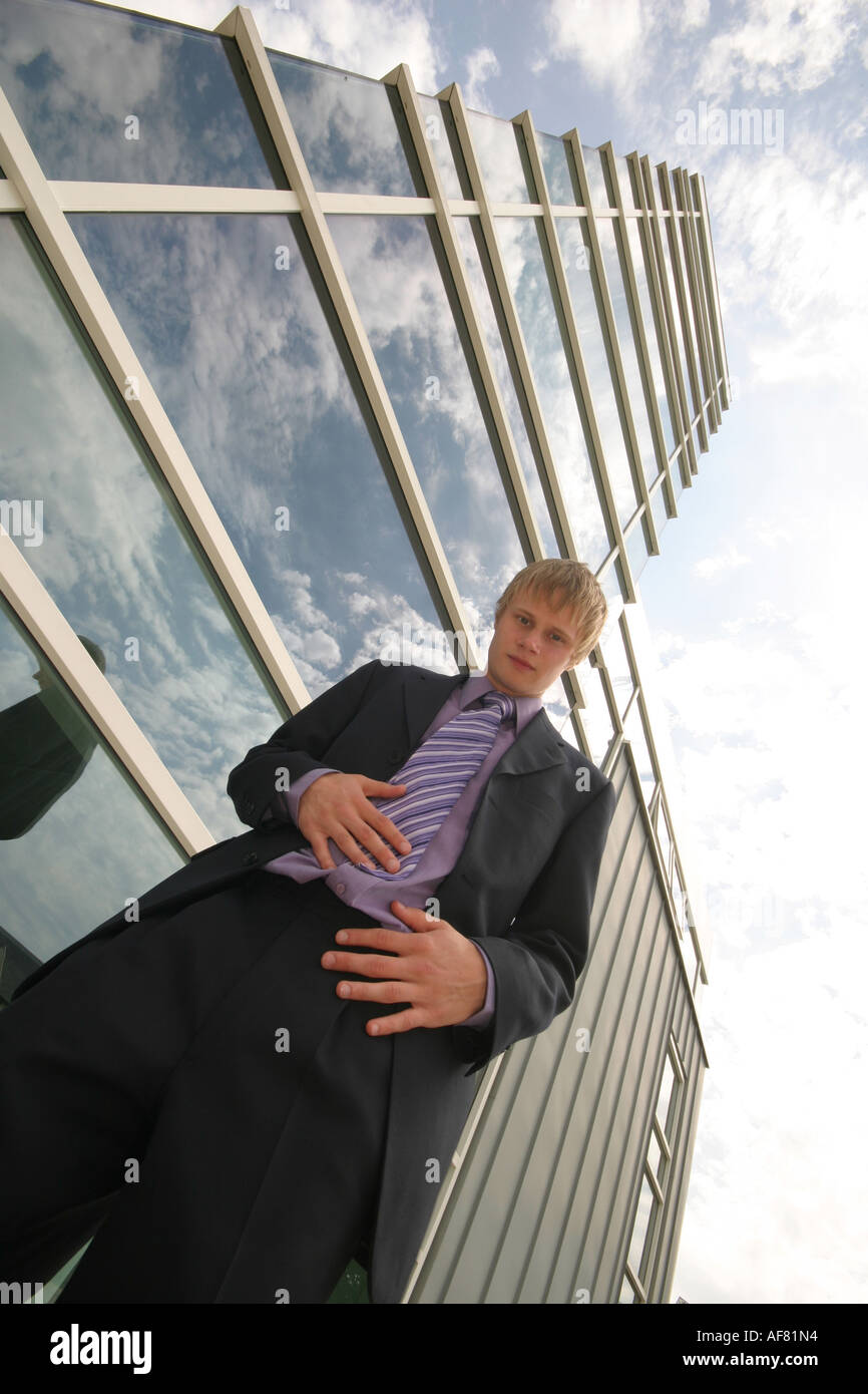 A Stock Photograph of a Young Adult Businessman Outside a Modern Office Block Stock Photo