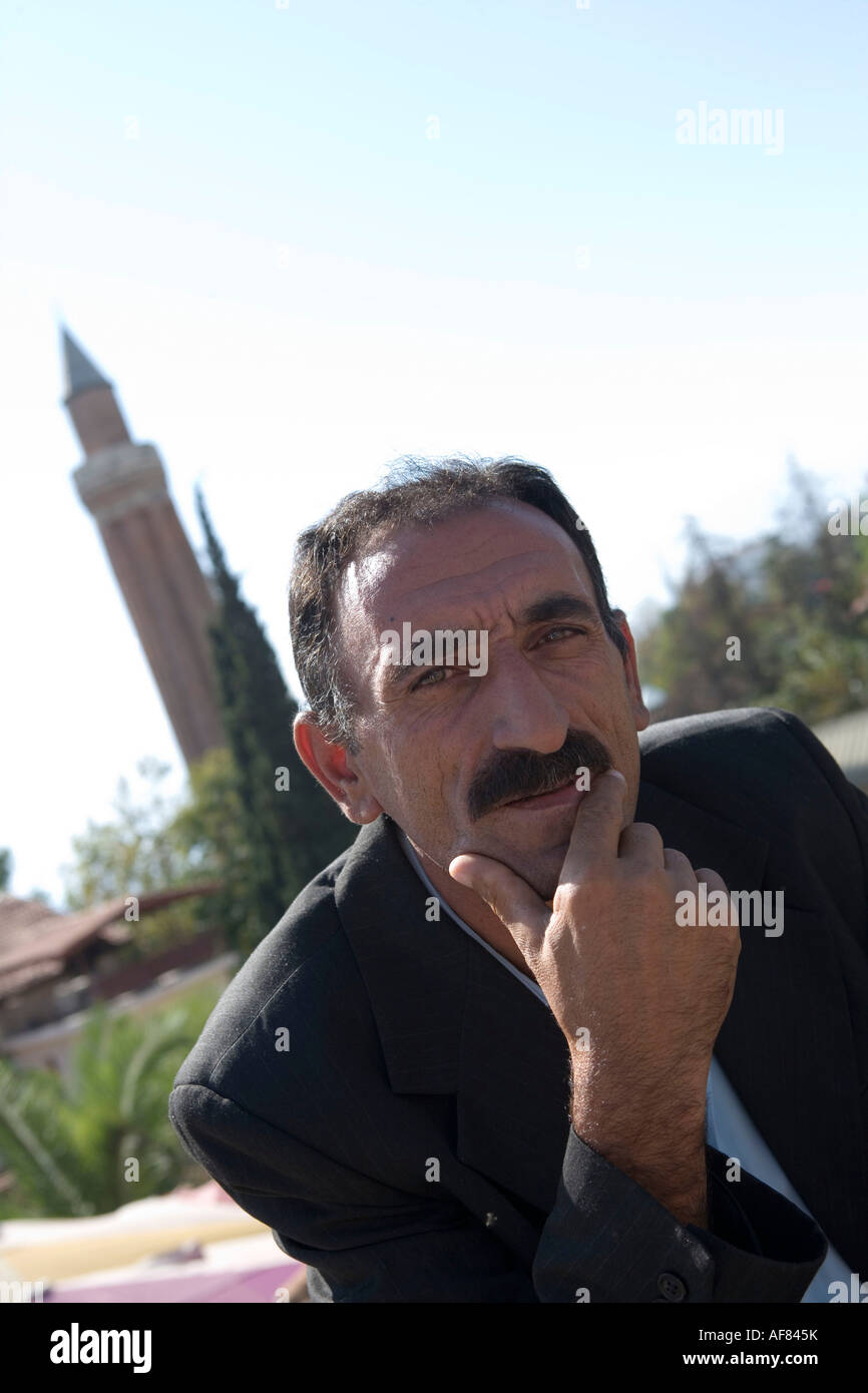 Turkish Man & Mosque Minaret, Old Town, Antalya, Turkey Stock Photo
