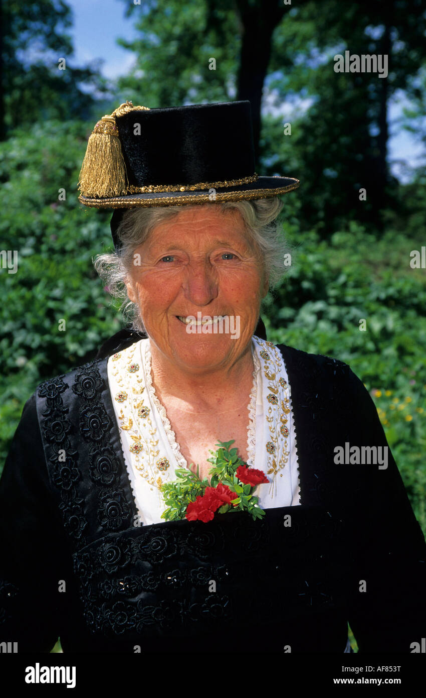 Elderly woman in dirndl dress with gold-ornamented hat, pilgrimage to Raiten, Schleching, Chiemgau, Upper Bavaria, Bavaria, Germ Stock Photo