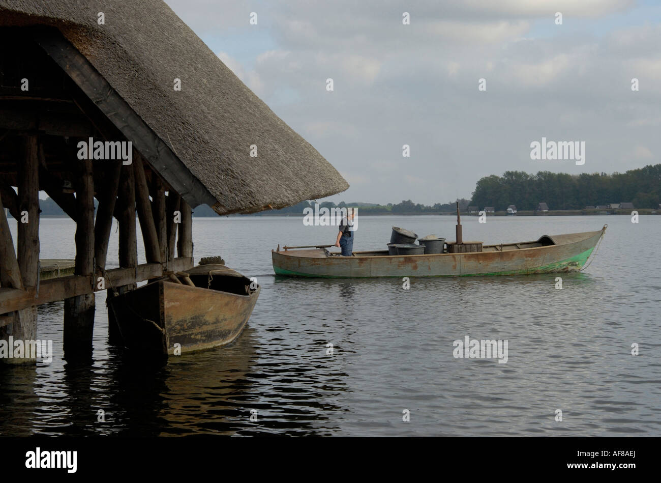 Man driving a boat on Lake Krakow, Mecklenburg-Western Pomerania ...