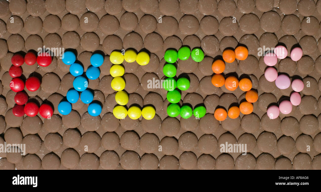 chocolates used to spell out the word excess Stock Photo Alamy