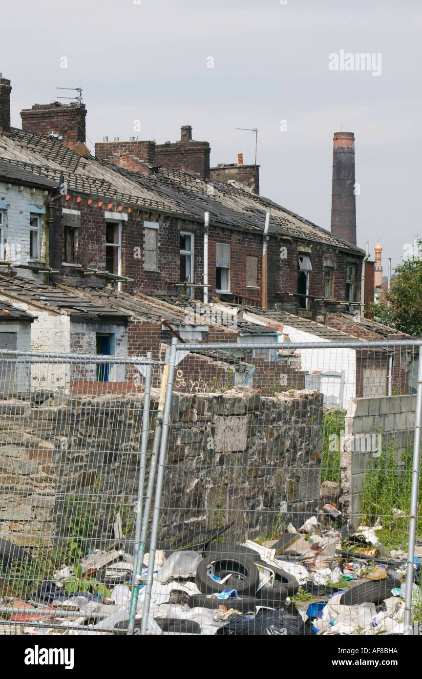 a row of old abandoned terraced houses in Blackburn, Lancashire, UK