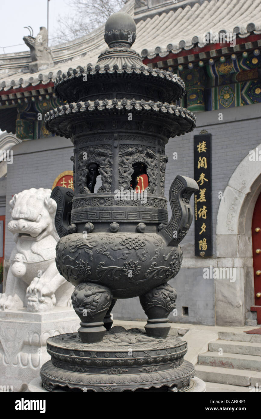 Incense burner near buddhist temple in the hutong of Beijing China