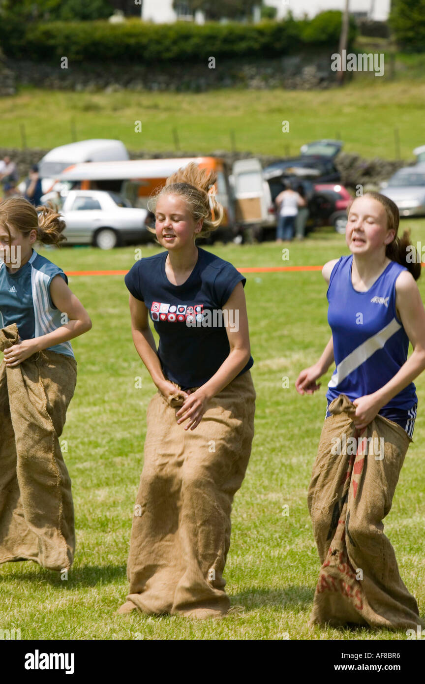 children in a sack race at the Langdale gala, Lake district, UK Stock Photo