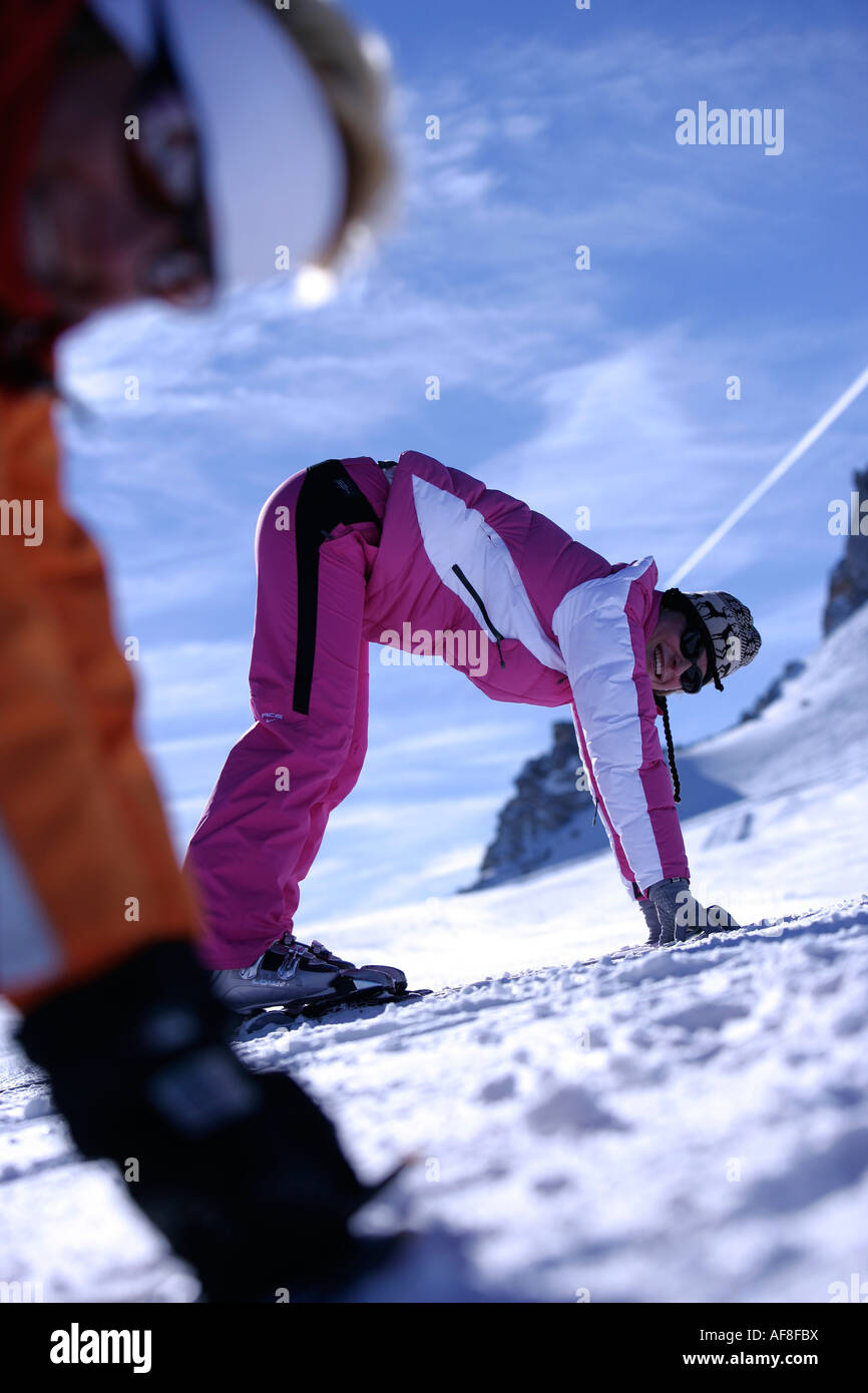 A woman having a skiing lesson with a ski instructor, Hintertux Glacier, Tyrol, Austria Stock Photo