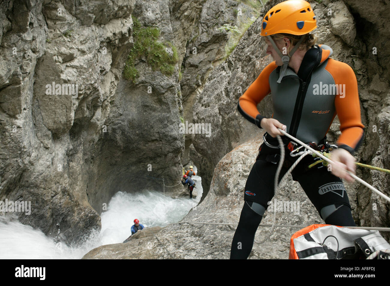 A group of people canyoning with guide, abseiling, Hachleschlucht, Haiming, Tyrol, Austria Stock Photo