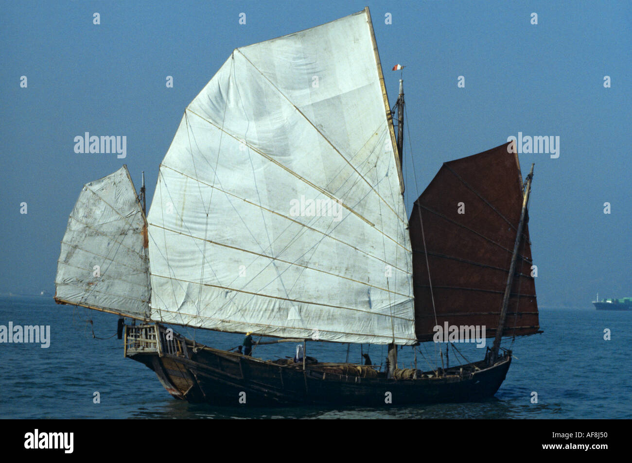 Stern & side view of traditional genuine old local sailing junk in the late 1970s in Victoria Harbour Hong Kong Island China Stock Photo