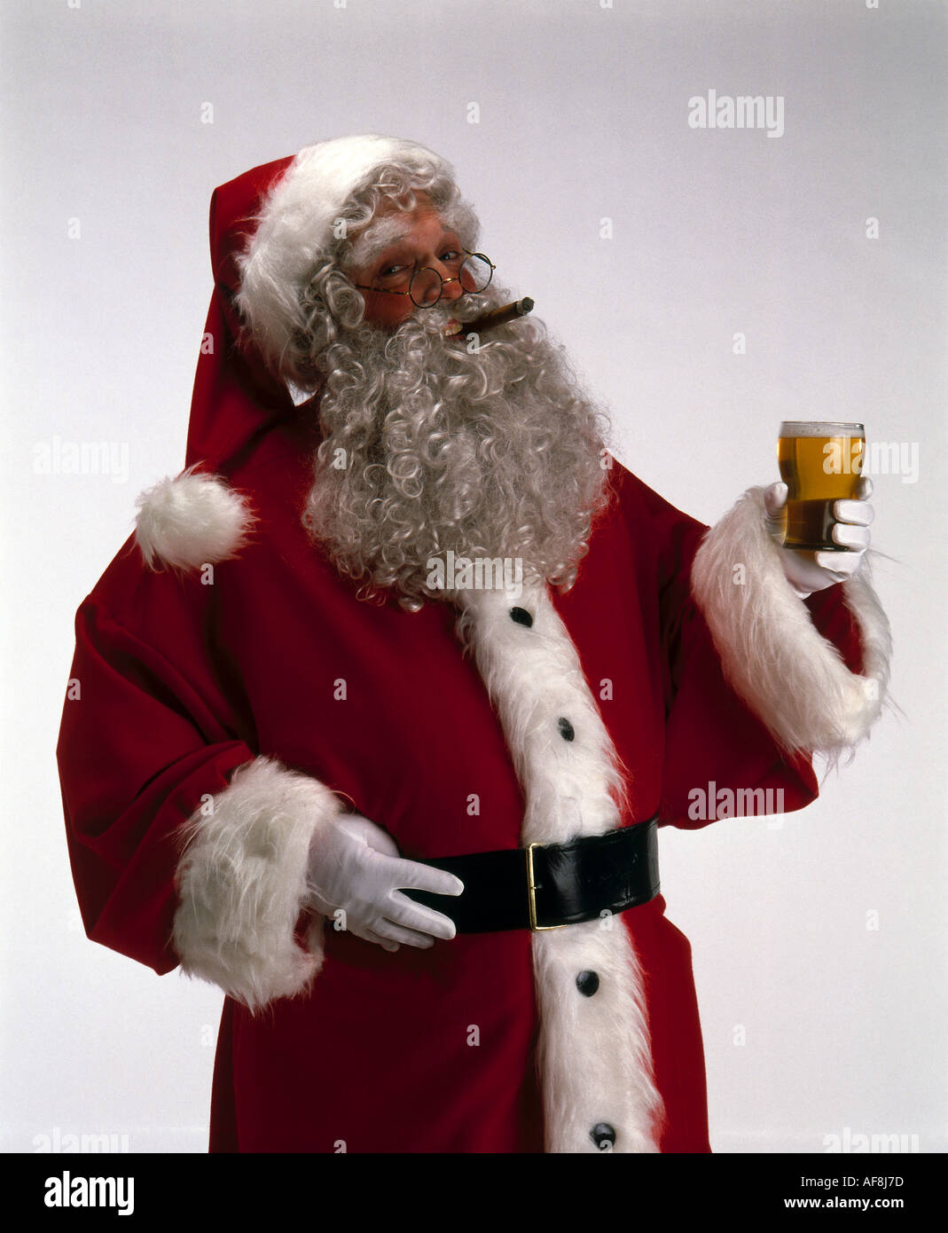 Father Christmas with cigar and beer Stock Photo - Alamy