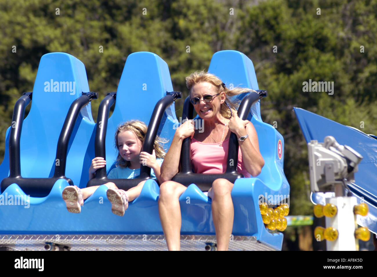 Cypress Gardens Adventure Park Florida Fl Winter Haven Florida attractions mother and daughter on colorful thrill ride Stock Photo