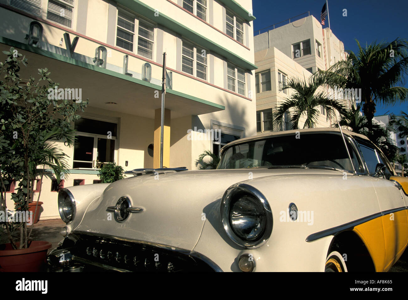 Miami Florida FL South Beach Art Deco 1950s white and yellow Chevrolet in front of Avalon Stock Photo