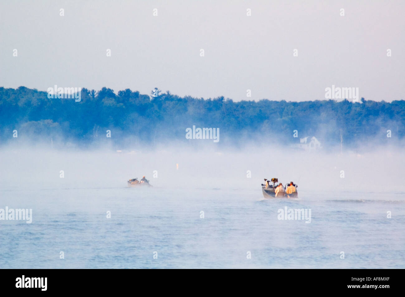 Fishermen head out to the big lake early in the morning Stock Photo