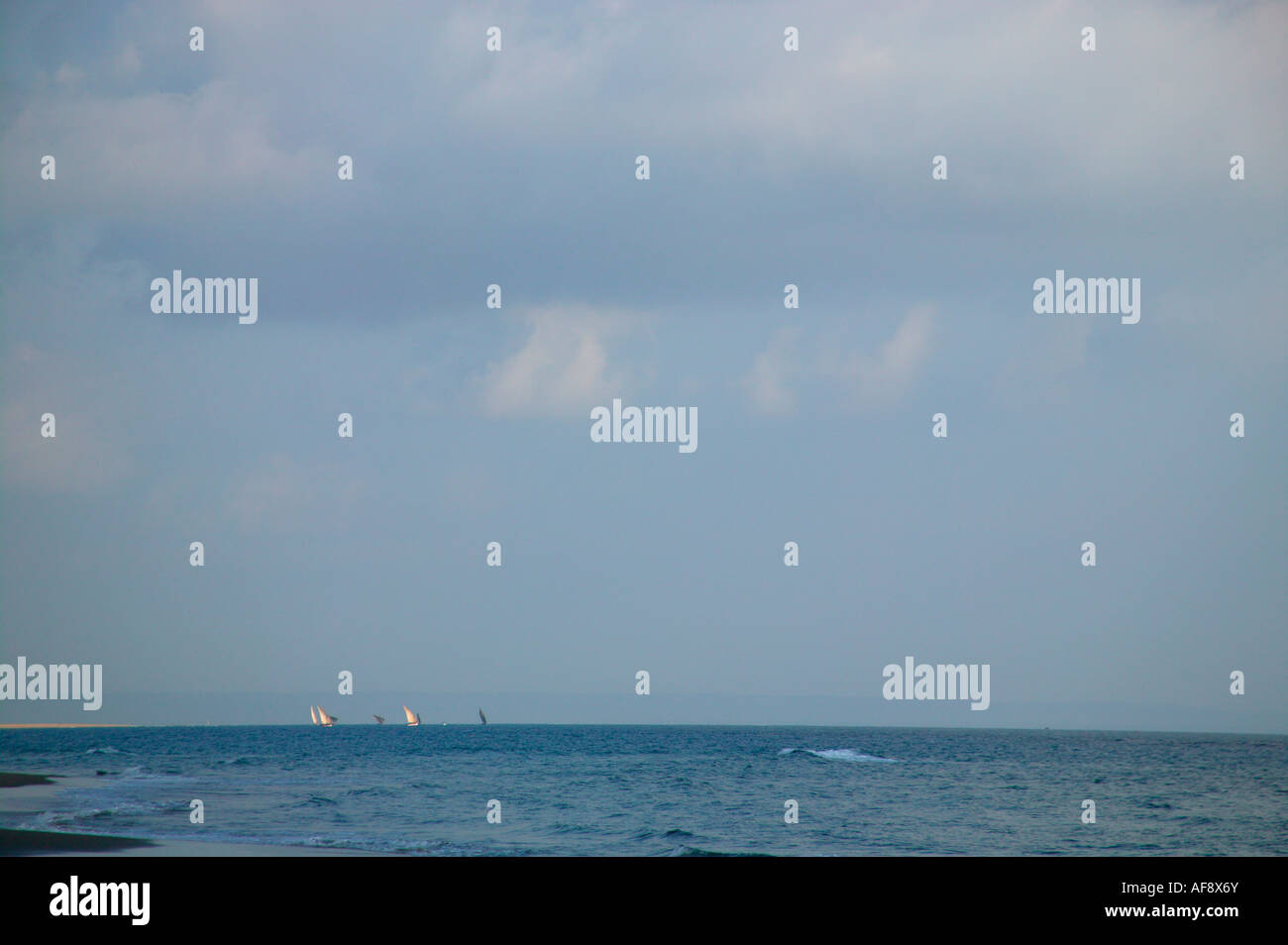 Distant view of dhows off the coast of Mozambique Stock Photo