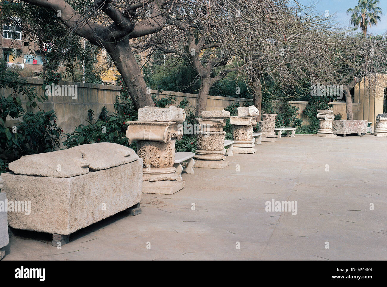 A sarcophagus and other Roman remains near the entrance to the Roman Catacombs in Alexandria Egypt Stock Photo