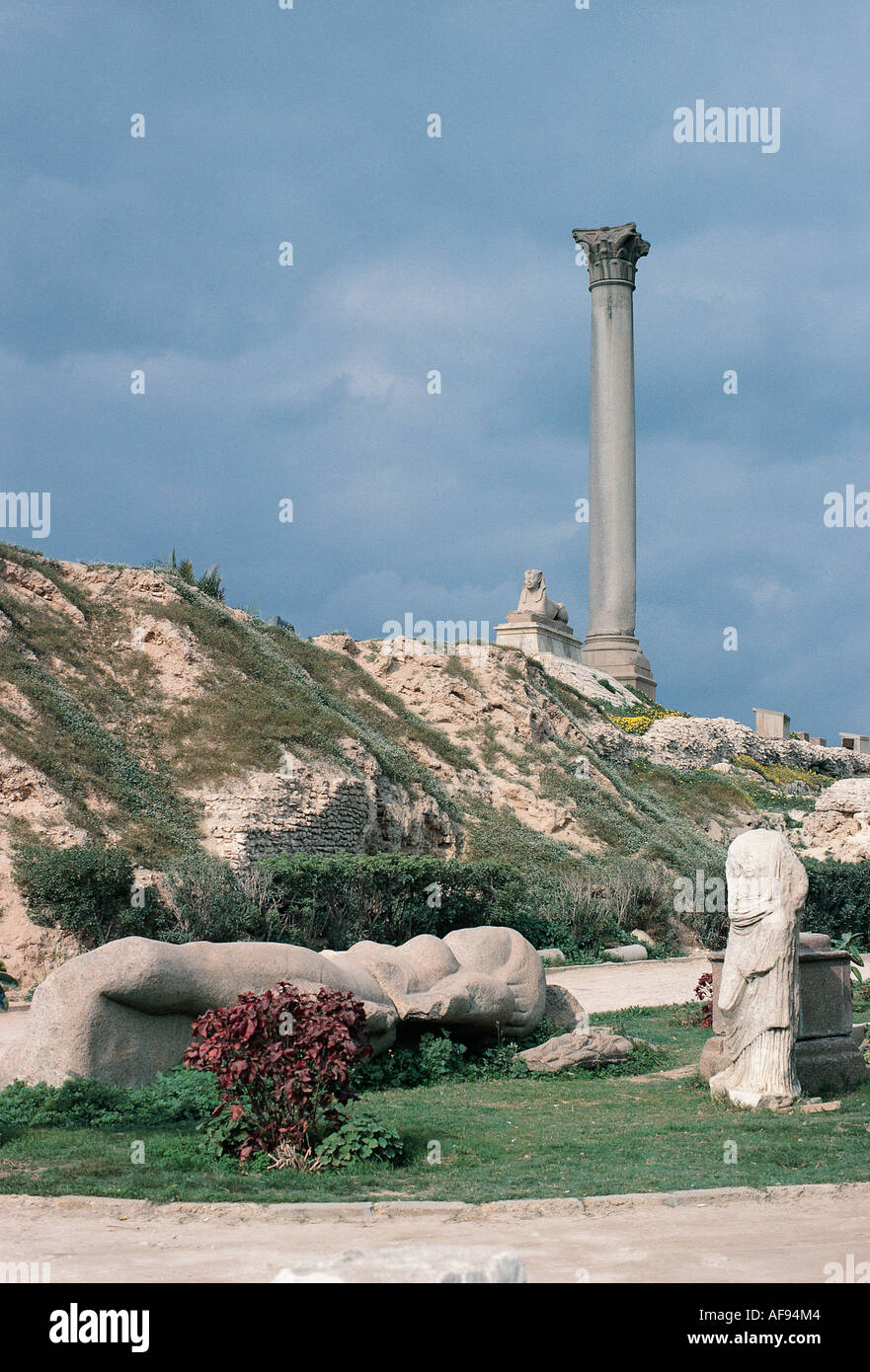 Pompey s Pillar or Serapeum and a Sphinx on the shore at Alexandria Egypt Stock Photo