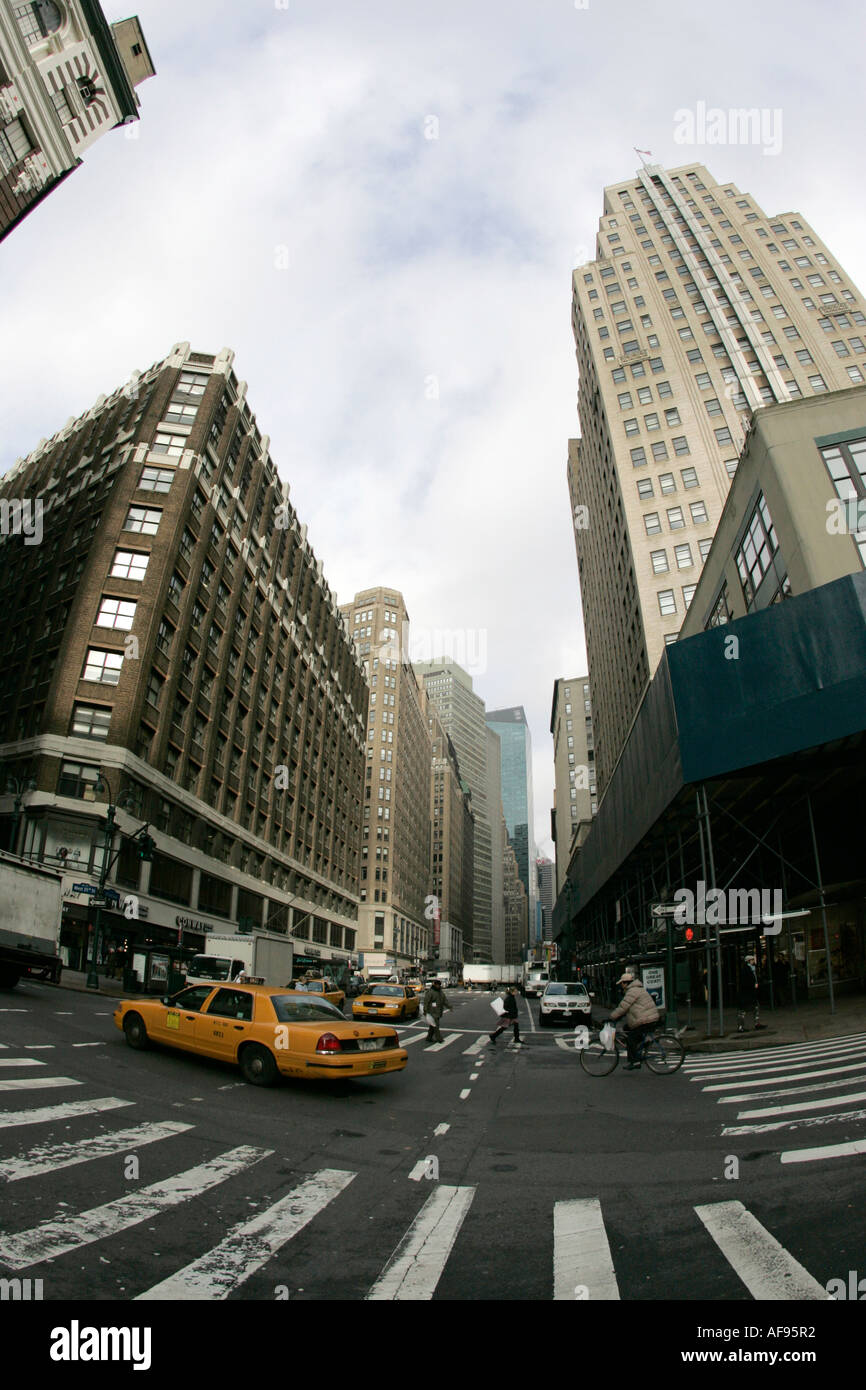 fisheye shot of yellow cab on intersection of broadway and 35th street at herald square new york city new york USA Stock Photo