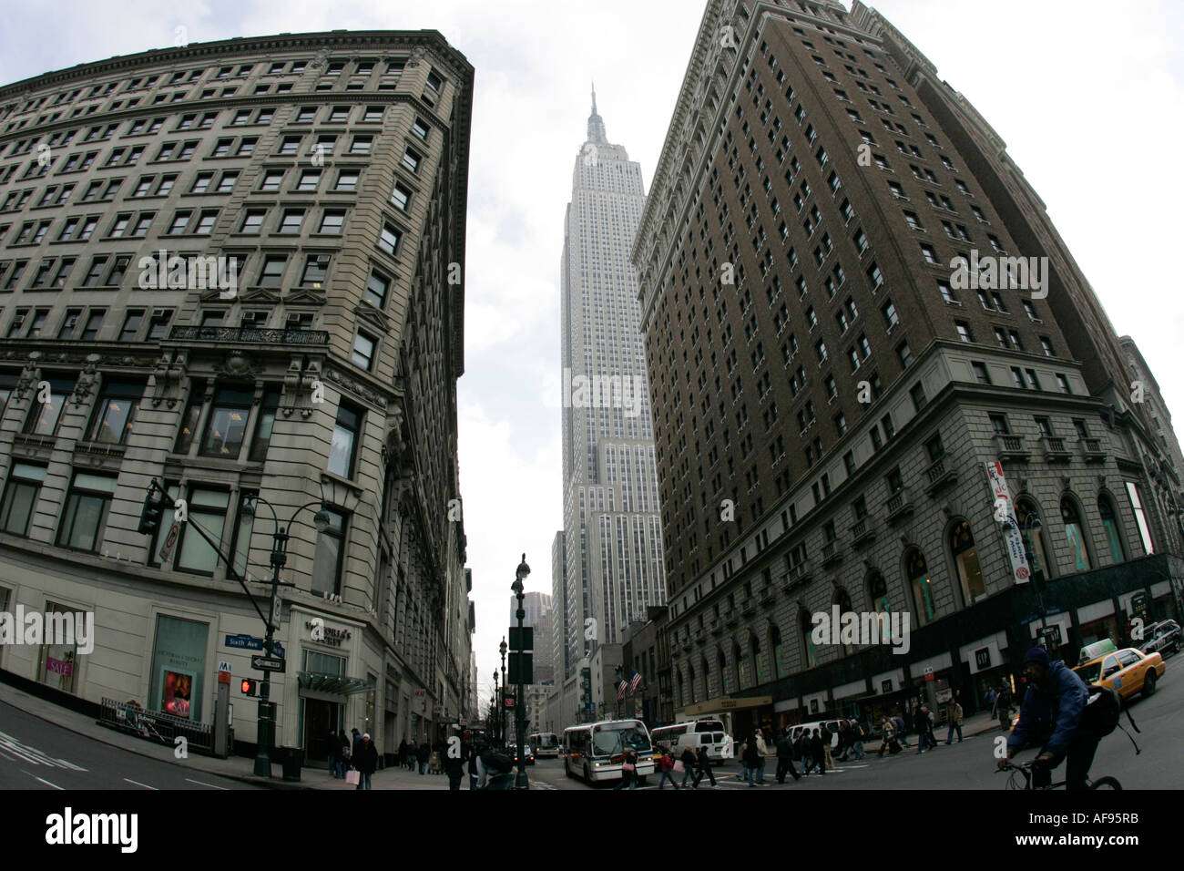 fisheye shot View of the empire state building from West 34th Street and Broadway junction including traffic Stock Photo