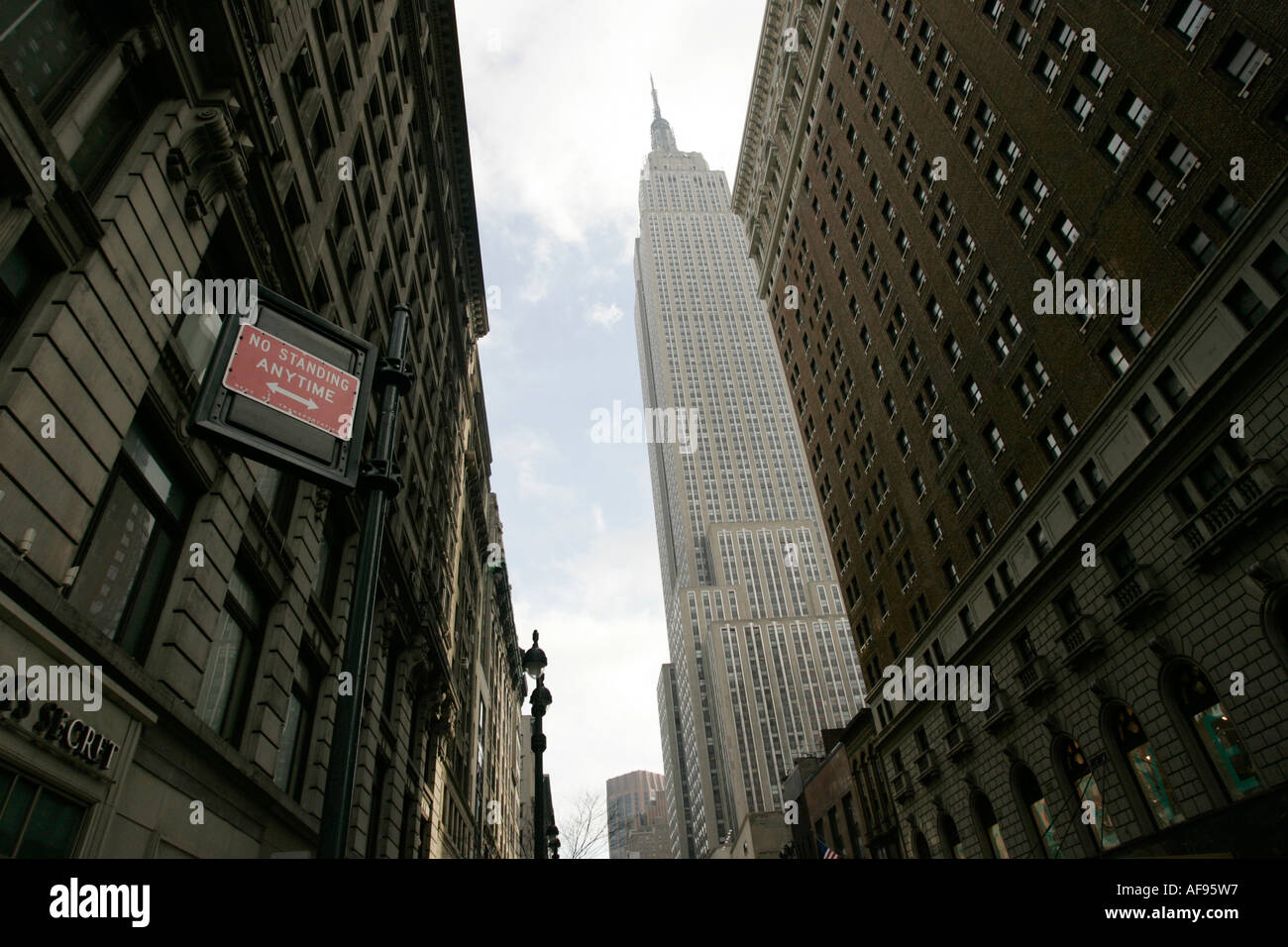 View of the empire state building from West 34th Street and Broadway junction new york city new york USA Stock Photo