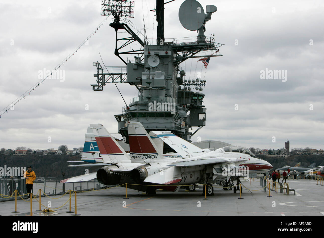Grumman F 14 in front of the bridge on the flight deck of the USS Intrepid at the Intrepid Sea Air Space Museum Stock Photo