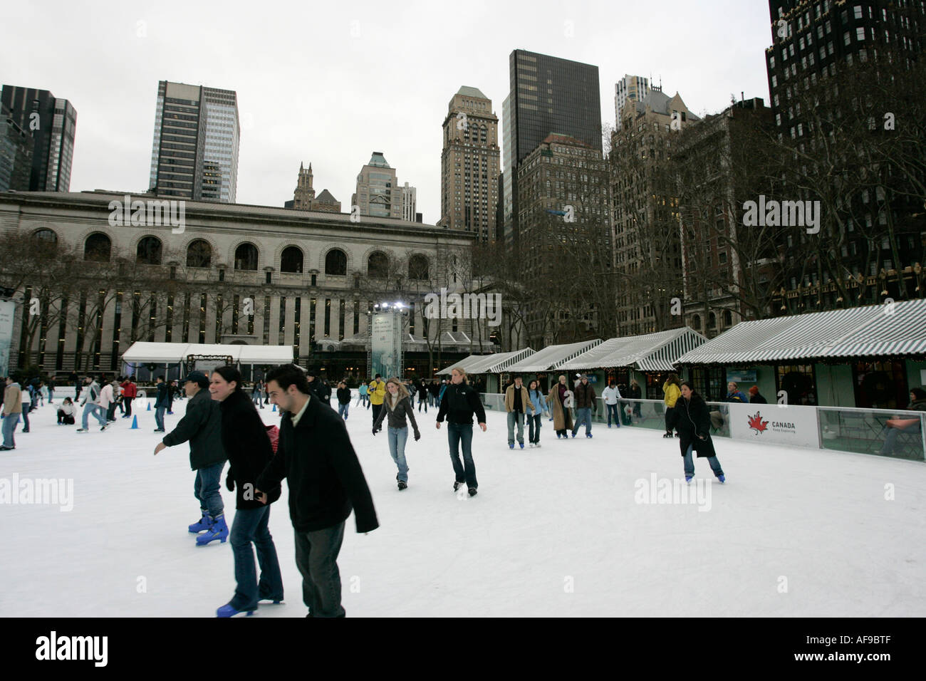 people skating on the ice at Bryant Park ice skating rink new york city