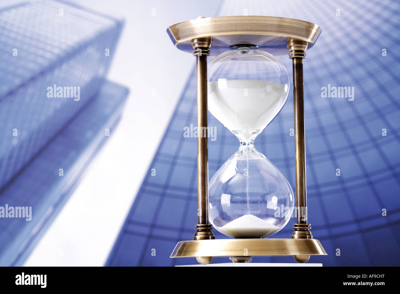 Hour glass against skyscrapers Stock Photo