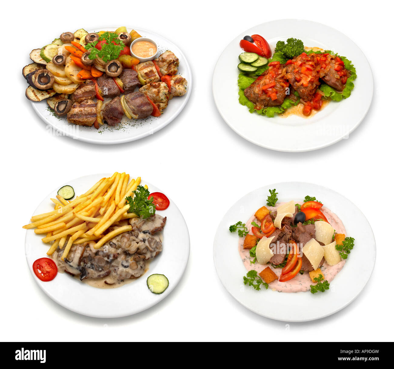 4 dishes with chicken, veal, pork meat and vegetables Stock Photo