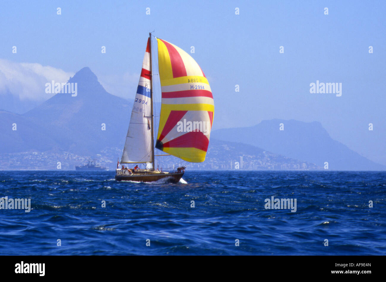 A yacht flying a spinnaker sailing in Table Bay Cape Town, Western Cape
