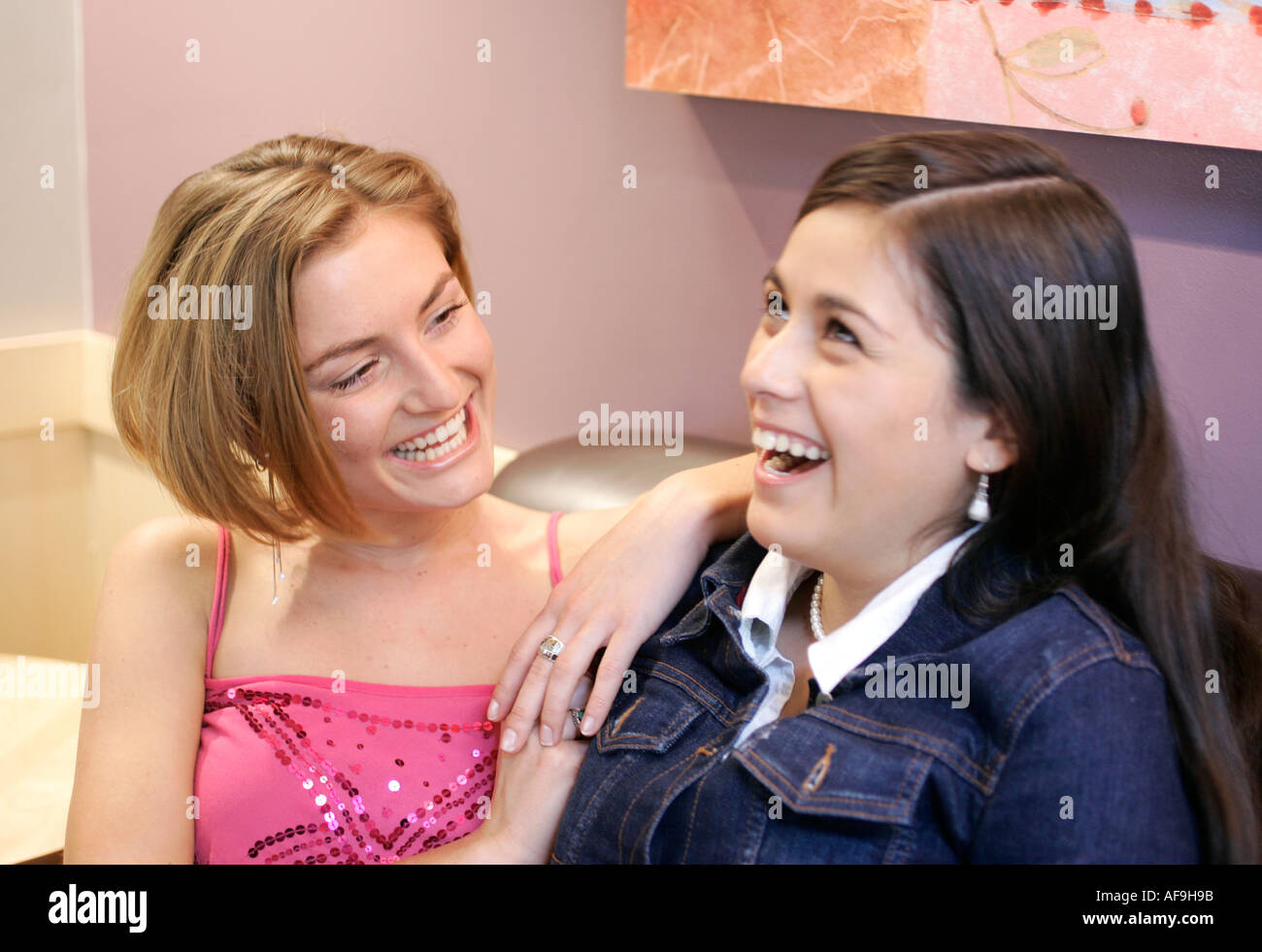Portrait of two young women in a coffee shop Stock Photo - Alamy