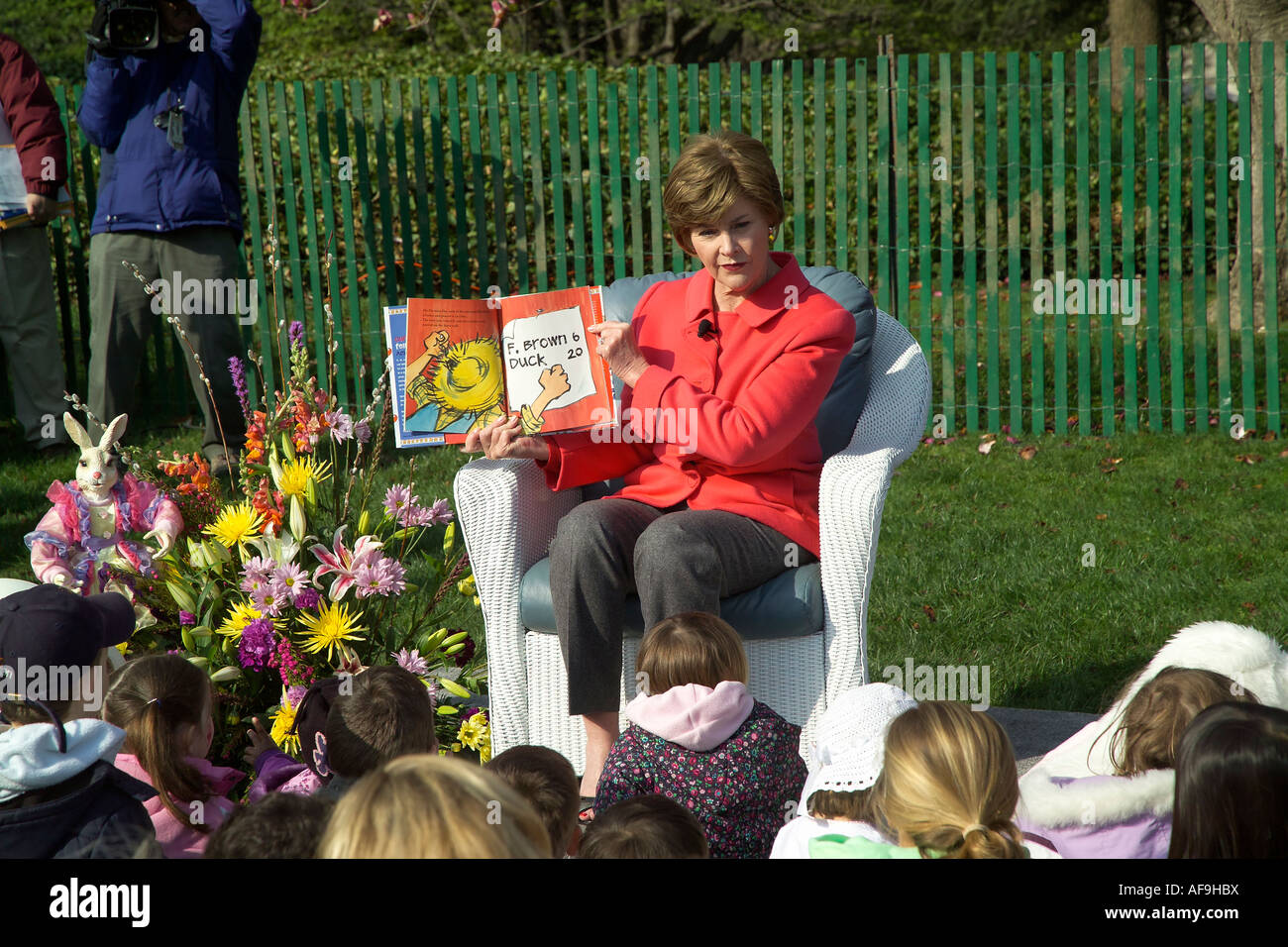 First Lady laura Bush reading a children book at the annual White House Easter egg roll 2007 Stock Photo