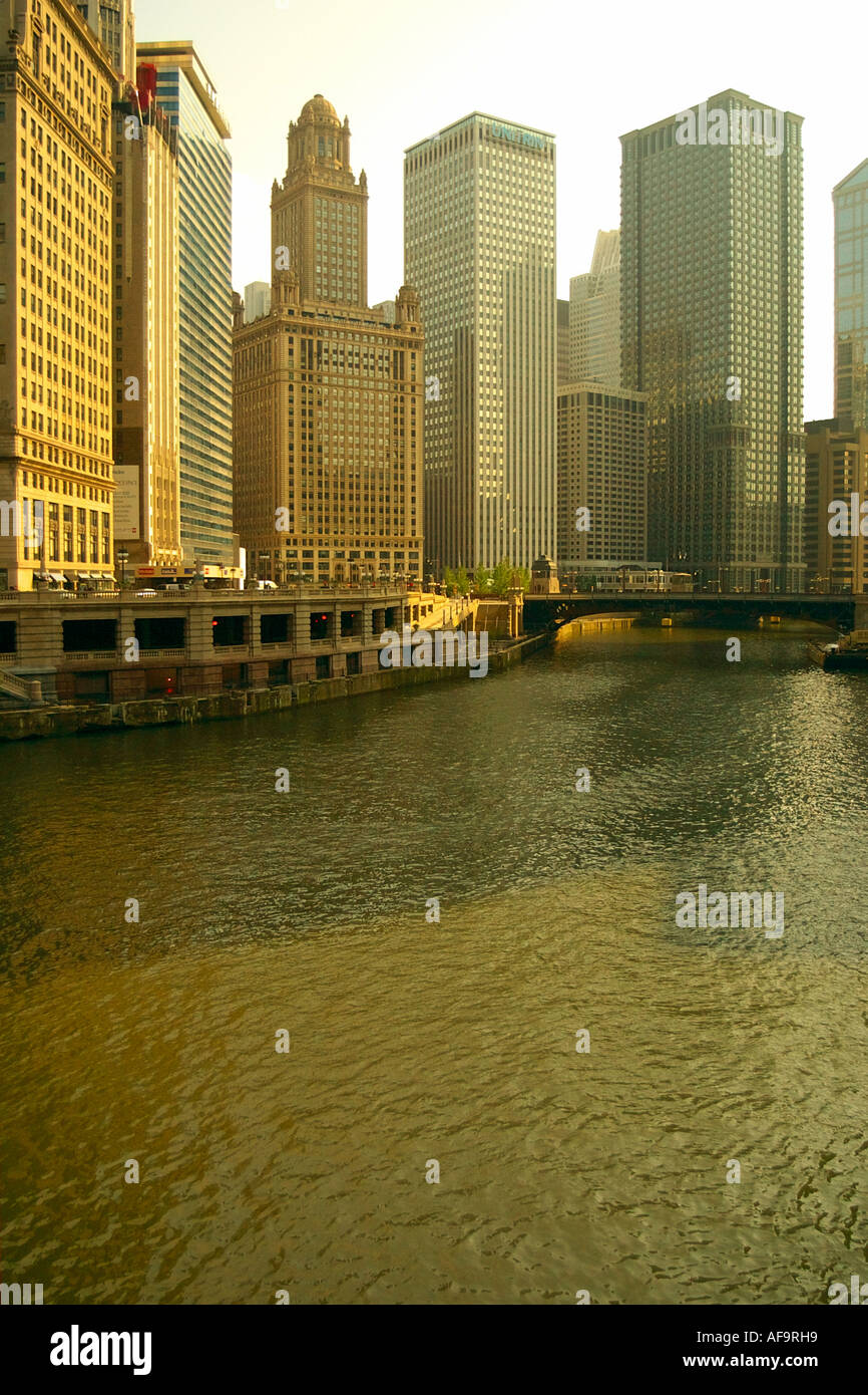 The downtown Chicago skyline seen over the Chicago river, late in the ...