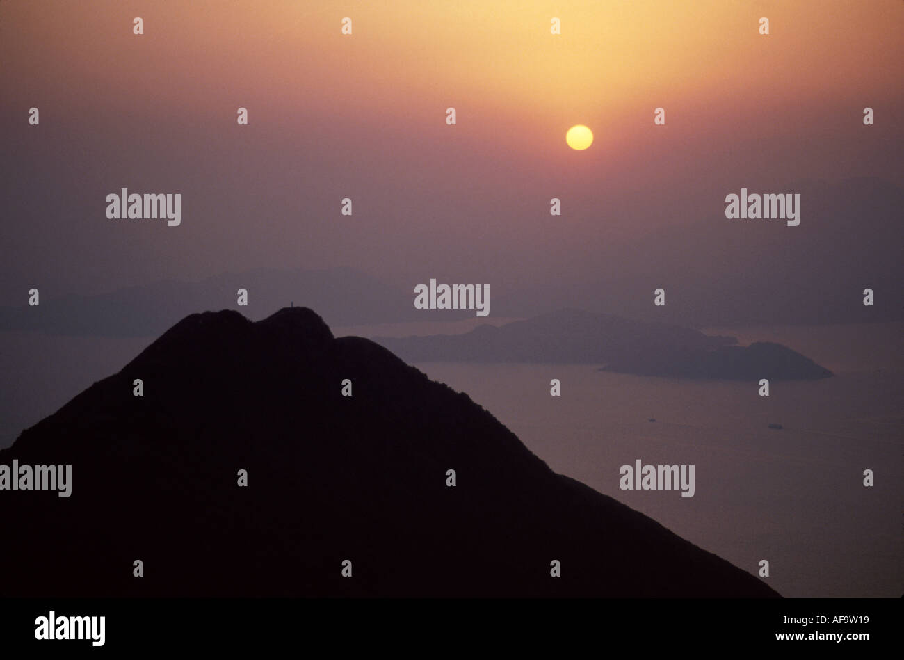 Hong Kong,Asia,Asian Asians ethnic immigrant immigrants minority,Far East,Eastern,Orient,Chinese,China,communism,communist,Victoria Peak,sunset,nature Stock Photo
