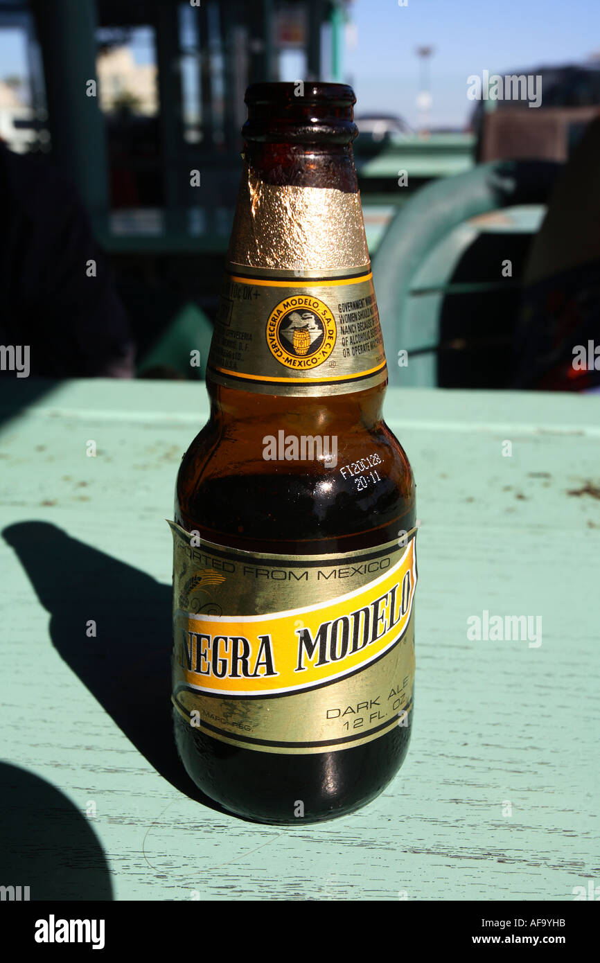 Bottle of Mexican beer on green tabletop, Los Angeles, California, United States of America. Stock Photo