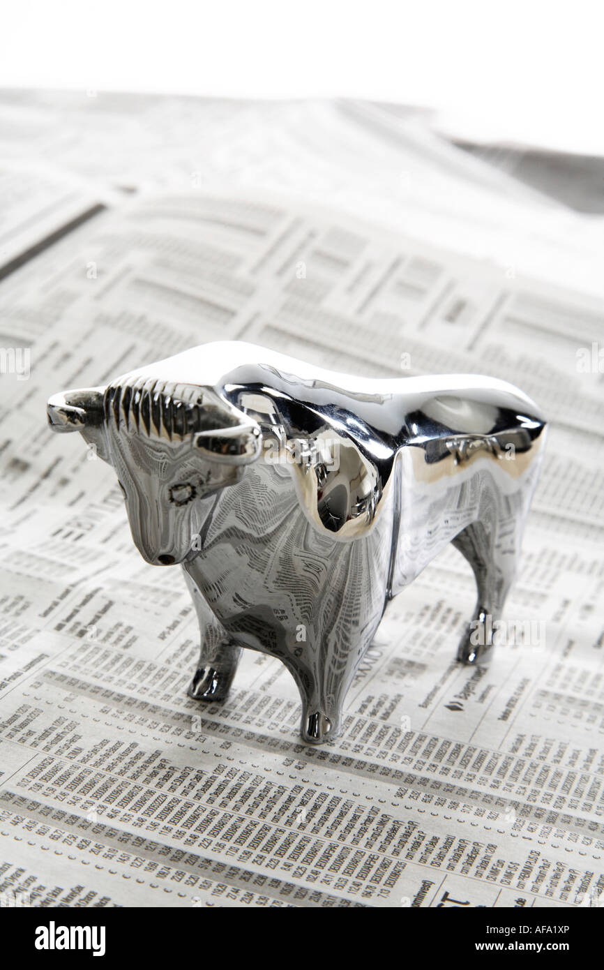 Bull figurine on journal, close-up Stock Photo - Alamy