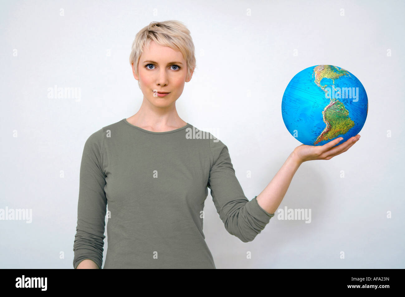 Female arm holding earth globe hi-res stock photography and images - Alamy