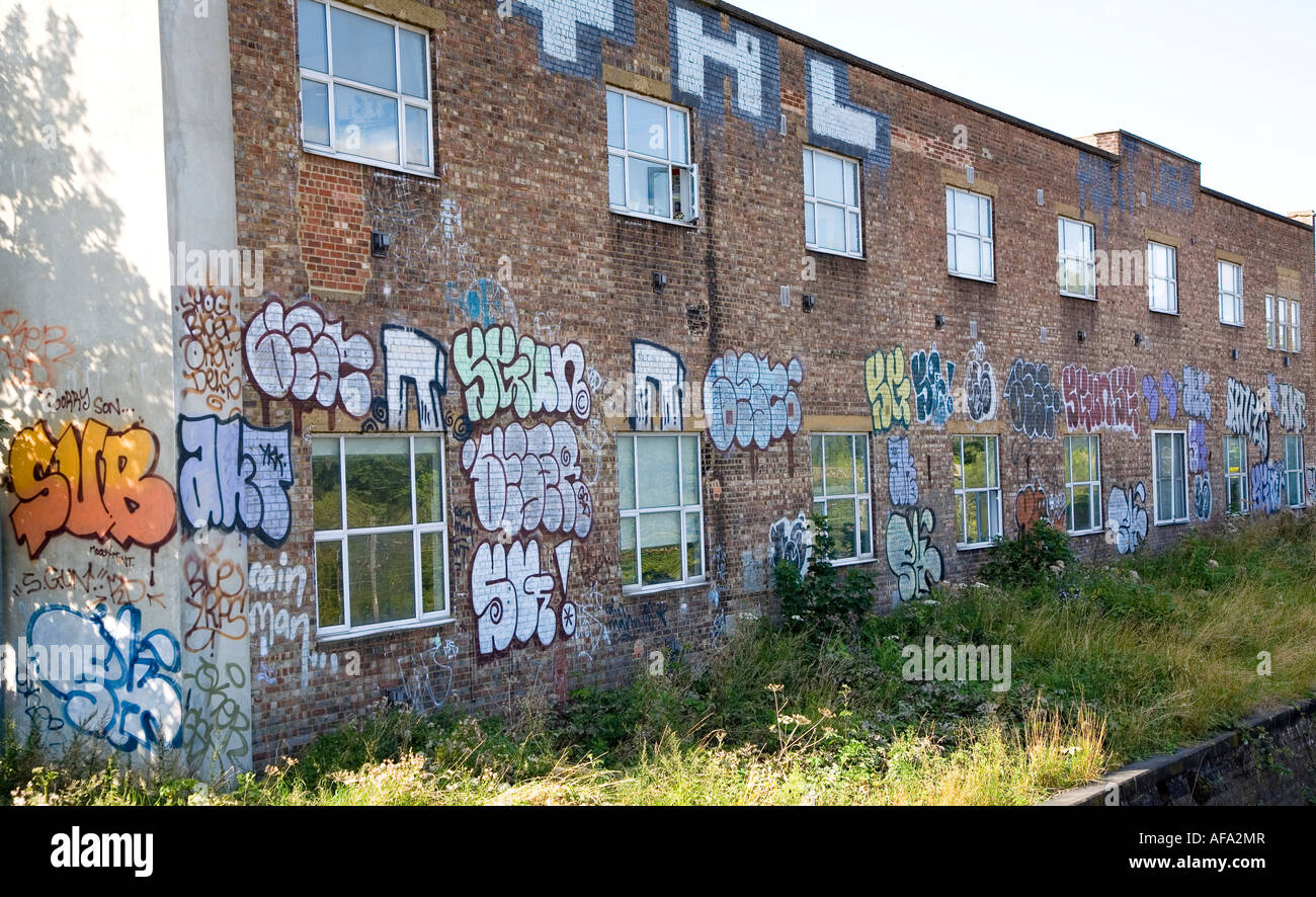 Run down wall with colourful graffiti hi-res stock photography and ...