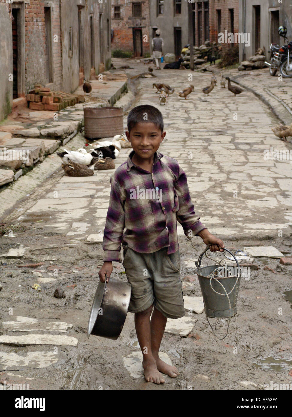 Boy in village street, Khokana, Nepal Stock Photo