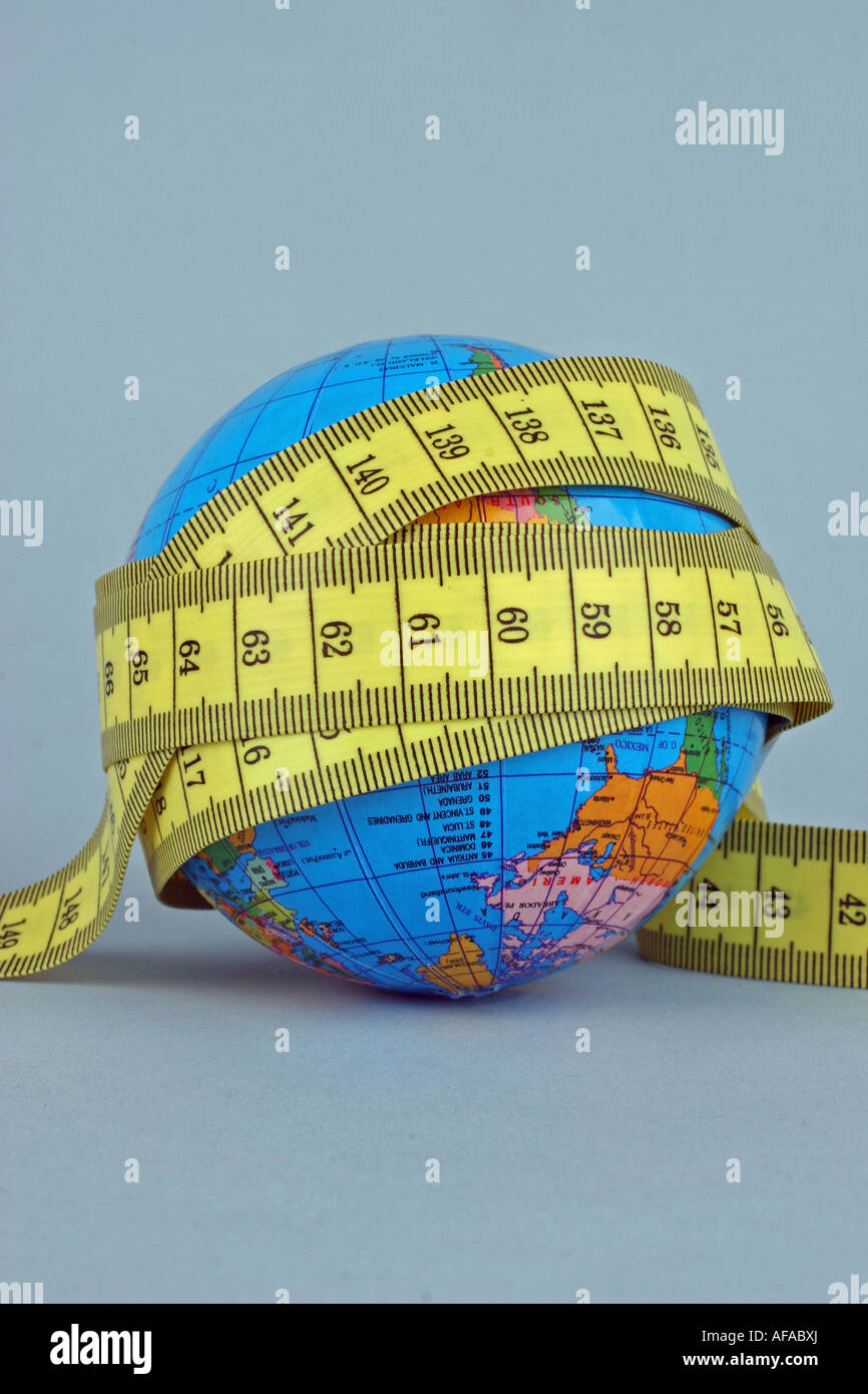 a globe and a tape measure Stock Photo