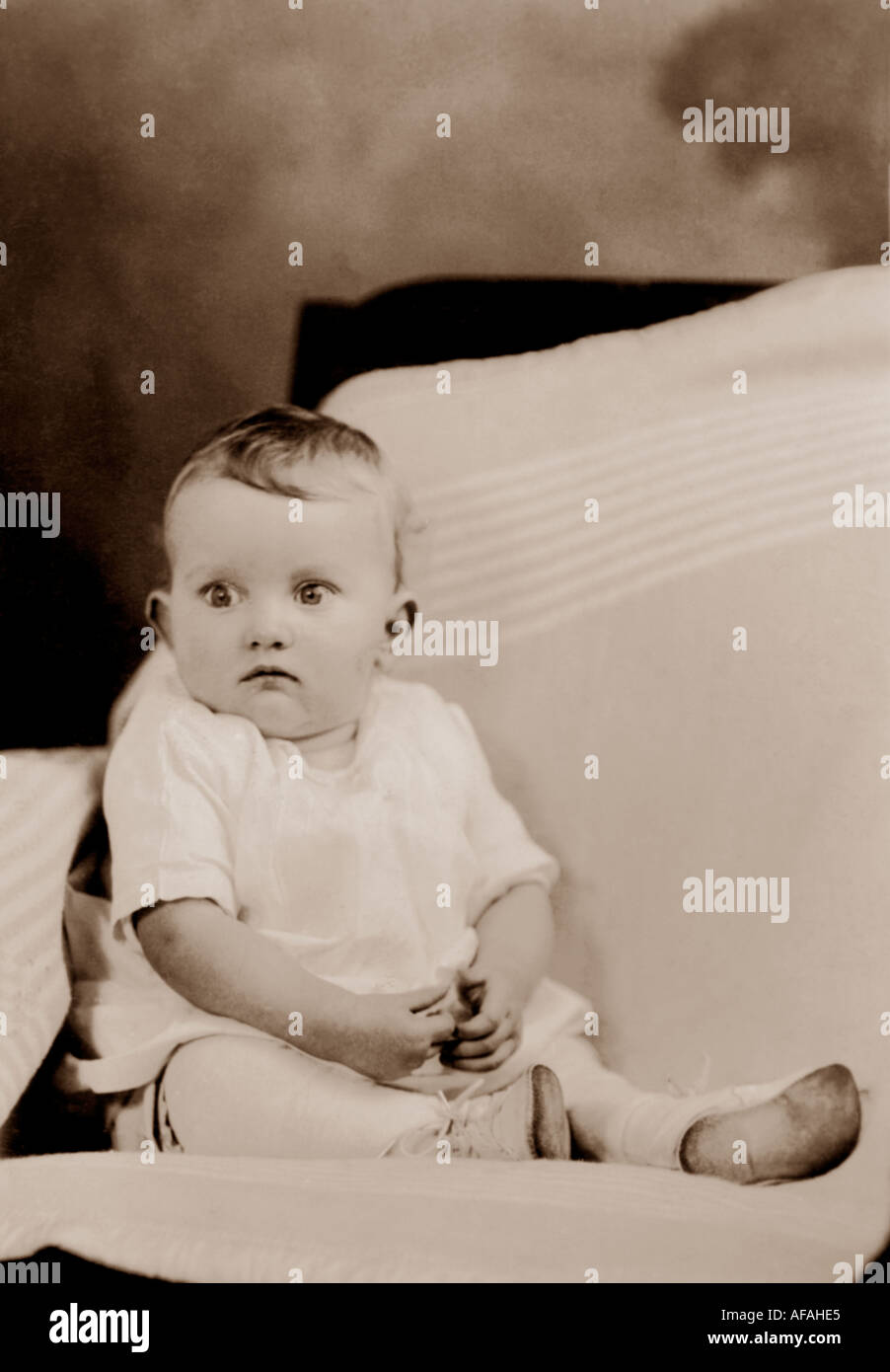 Early 1900's photograph of baby making a funny face, U.K. Stock Photo