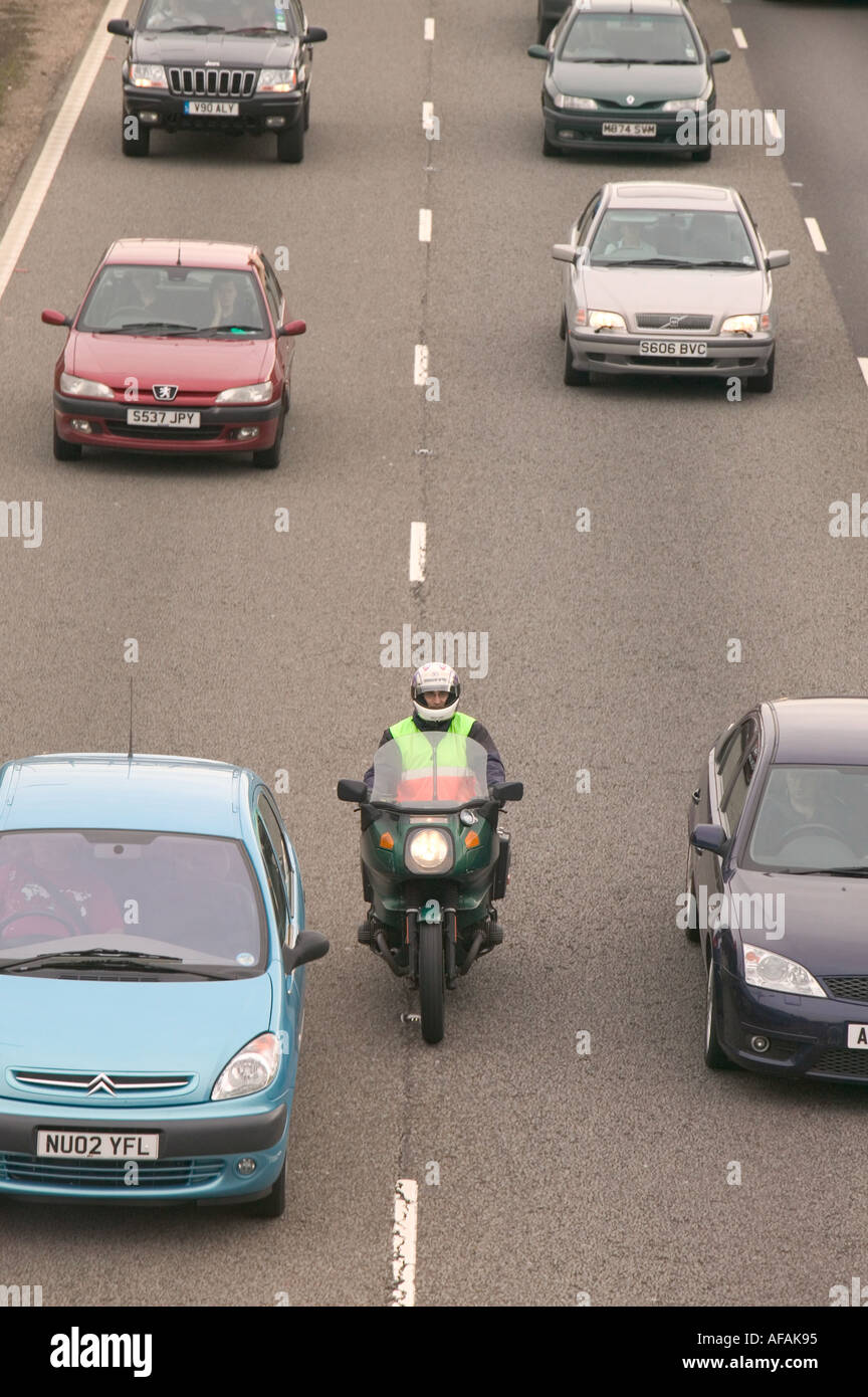 a motorbike between lanes of delayed traffic on the M1 motorway at Kegworth leicestershire UK Stock Photo