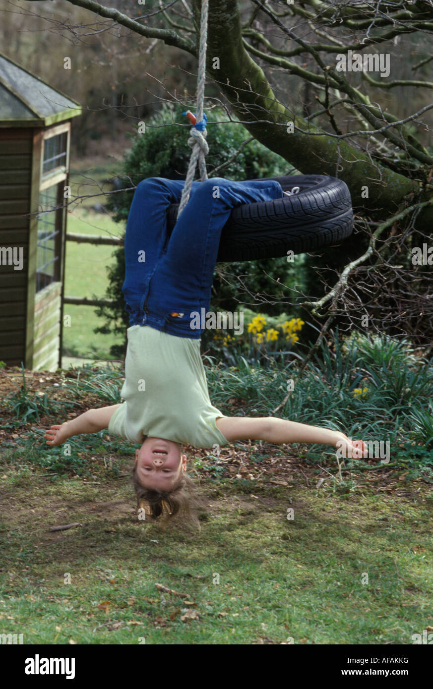 Girls hanging upside down on hi-res stock photography and images - Alamy