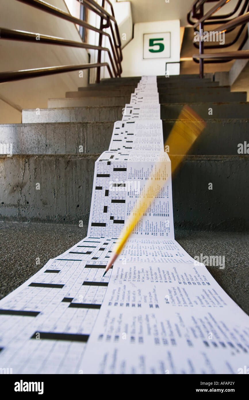 pencil on crossword puzzle on stairs Stock Photo Alamy
